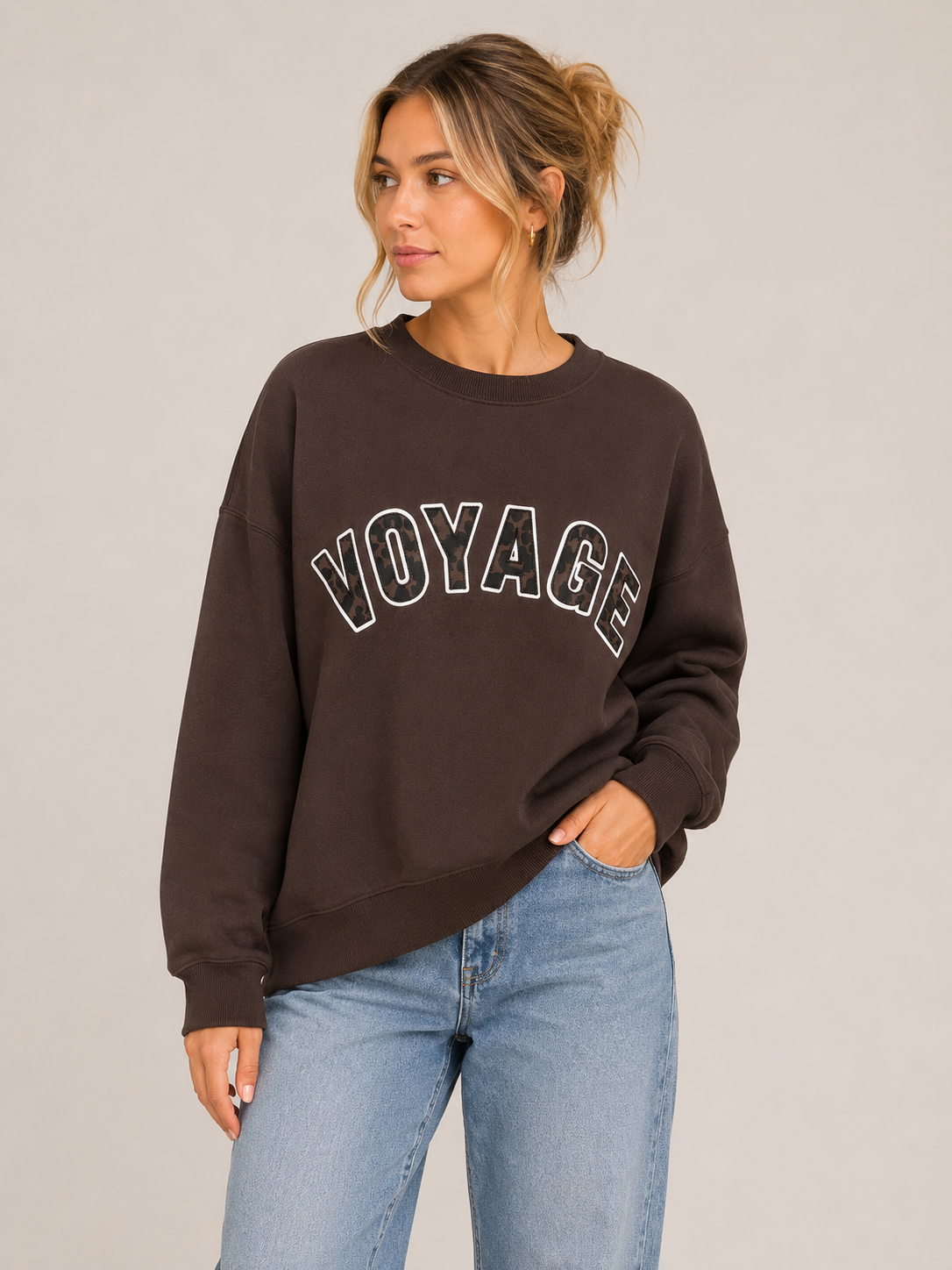brown sweatshirt featuring the Voyage design.