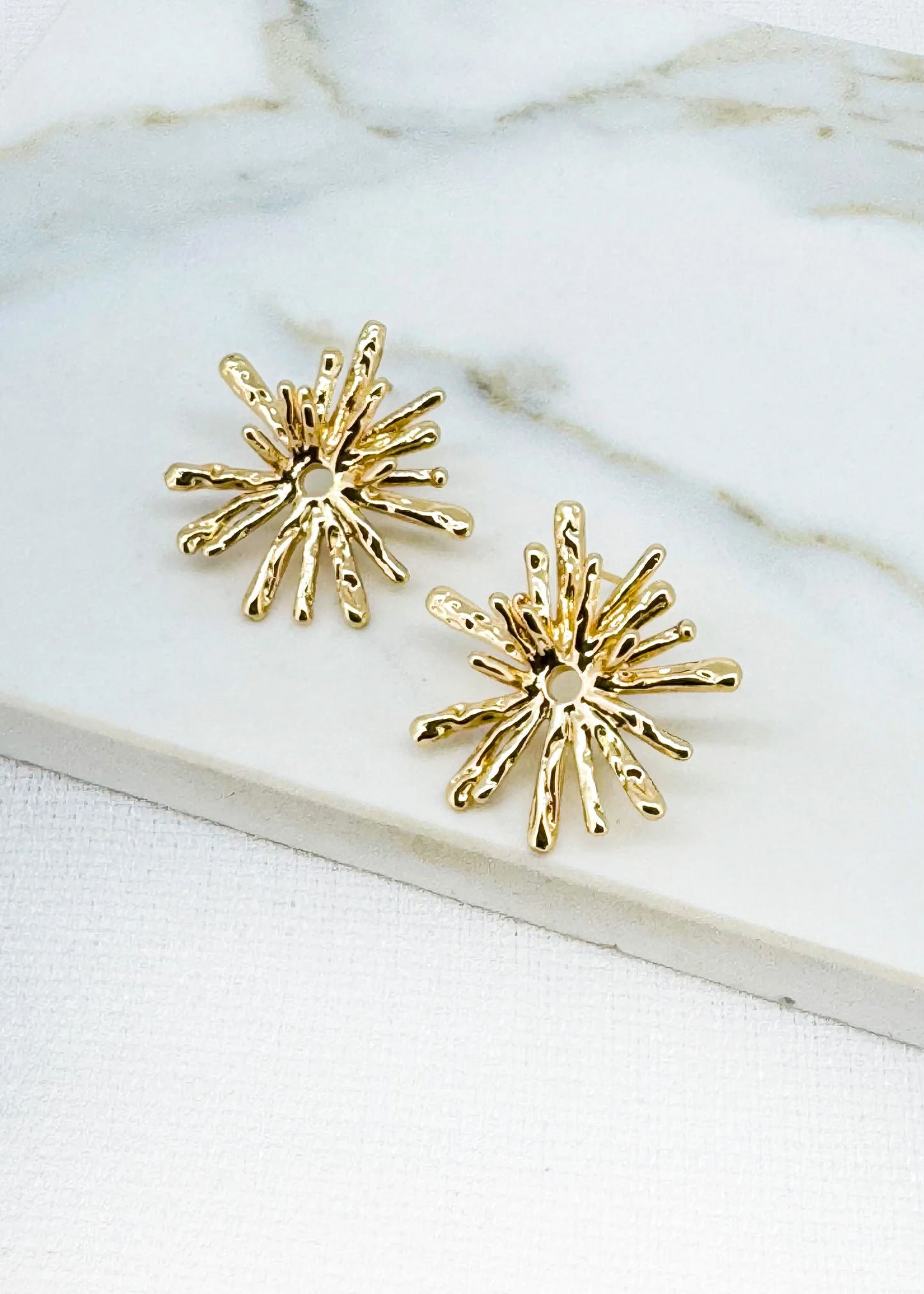Gold starburst earring
