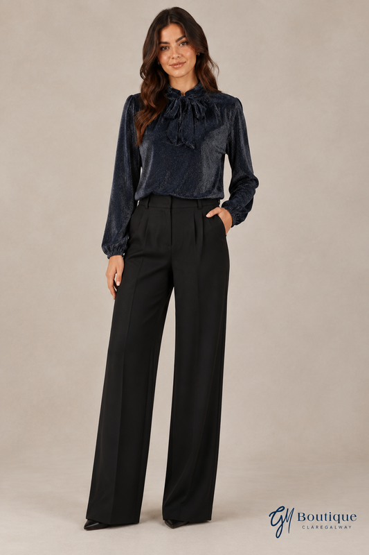 Evening styling preview with Mos Mosh black sateen pants, dark blue Oui tie-neck blouse and pointed black heels sold at GM Boutique